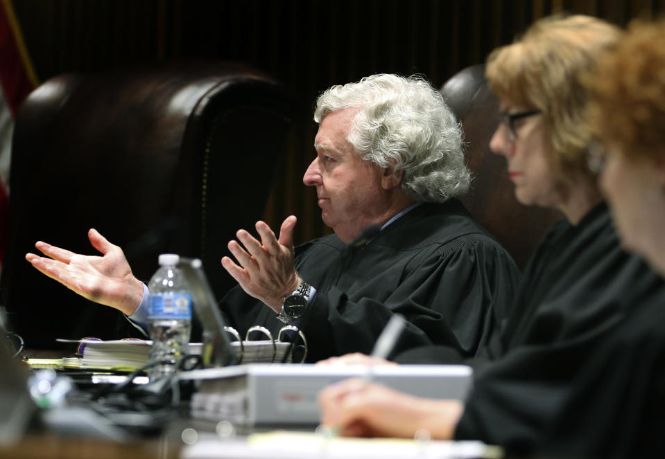 Kansas Supreme Court Justice Dan Biles gestures during arguments over whether a new congressional redistricting law enacted by Republican lawmakers violates the state constitution, Monday, May 16, 2022, in Topeka, Kan. The Supreme Court is considering the state's appeal of a lower-court ruling that struck down the law and ordered the Legislature to draft a new redistricting plan (Thad Allton/Kansas Reflector via AP, Pool)