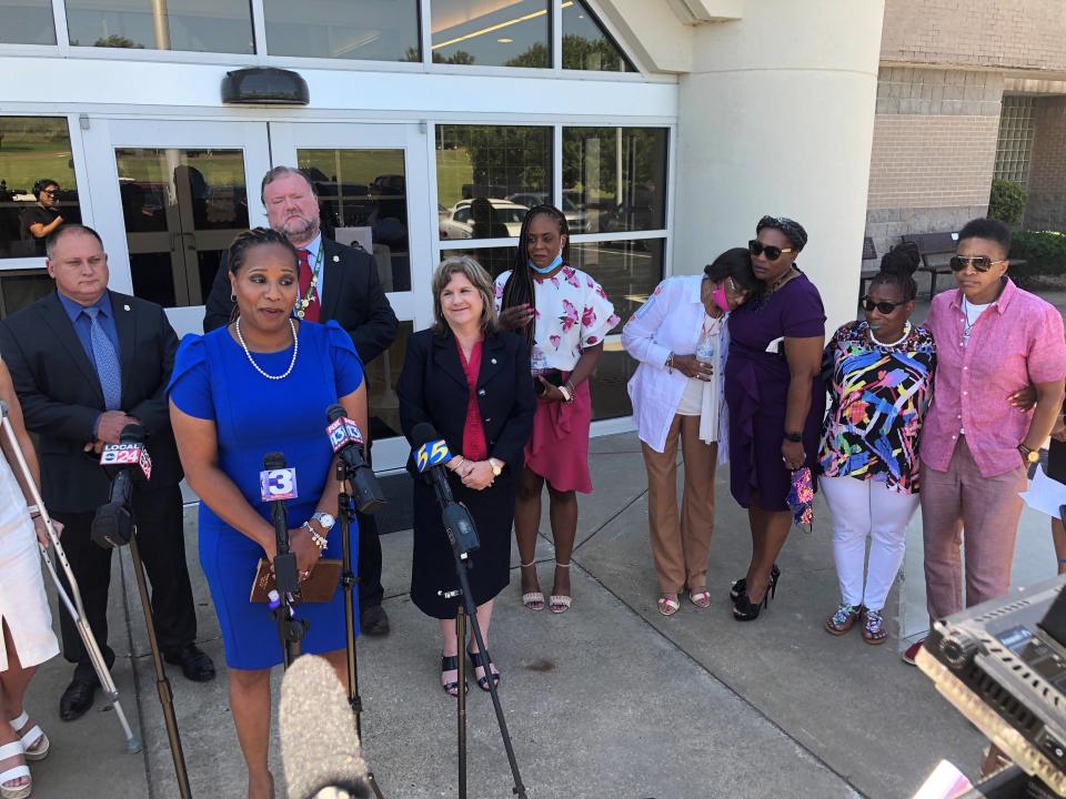 Shernaye Johnson (at microphone) talks to reporters after a Tennessee inmate was sentenced to life in prison in the death of her mother, Tennessee Department of Correction administrator Debra Johnson, on Monday, June 14, 2021, in Ripley, Tenn. Convicted felon Curtis Ray Watson pleaded no contest to first degree murder in perpetration of rape in the August 2019 killing of Johnson, who lived in a house on the grounds of the West Tennessee State Penitentiary. Prosecutors said Watson killed Johnson in her home before escaping the prison on a tractor. (AP Photo/Adrian Sainz)