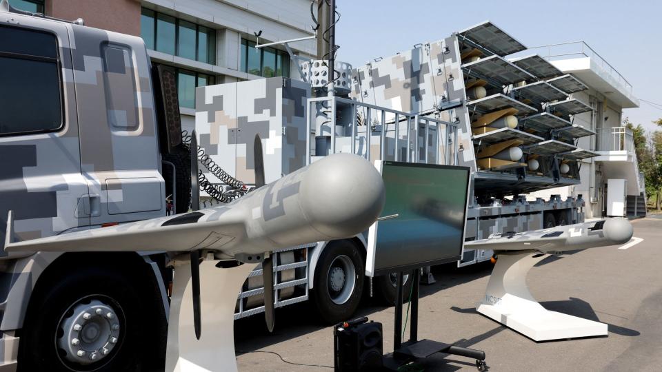 Chien Hsiang loitering munitions and a 12-cell trailer mount launcher on display at a media event in Taiwan in 2022. <em>I-HWA CHENG/AFP via Getty Images</em>