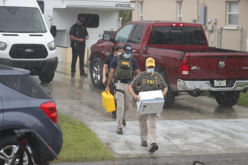 <div class="inline-image__caption"><p>FBI agents begin to take away evidence from the family home of Brian Laundrie.</p></div> <div class="inline-image__credit">Octavio Jones/Getty</div>