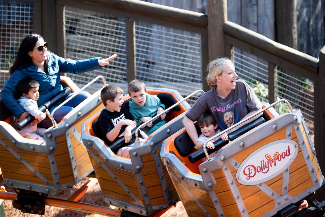 Guests enjoy the Whistle Punk Chaser ride on opening day at Dollywood on March 11, 2022.