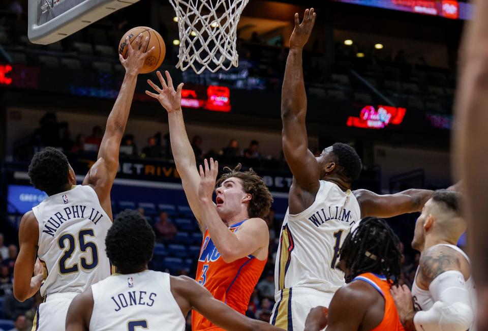Pelicans guard Trey Murphy III (25) blocks a shot by Thunder guard Josh Giddey in the first quarter of OKC's 105-101 loss in New Orleans on Monday night.