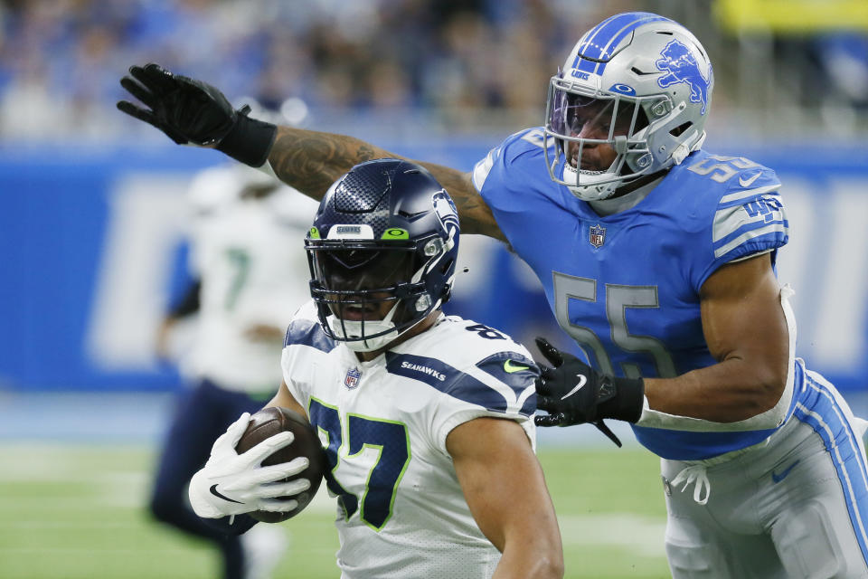 Detroit Lions linebacker Derrick Barnes (55) reaches in on Seattle Seahawks tight end Noah Fant (87) during the second half of an NFL football game, Sunday, Oct. 2, 2022, in Detroit. (AP Photo/Duane Burleson)