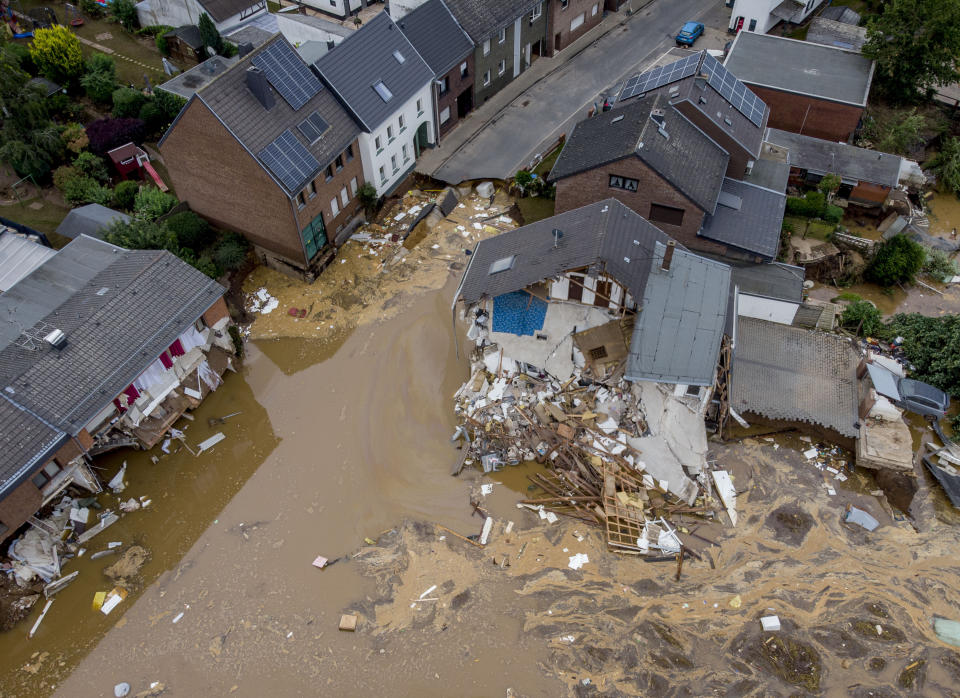 A destroyed house is seen in Erftstadt-Blessem, Germany, Saturday, July 17, 2021. Due to strong rain falls the small Erft river went over the banks causing massive damages. (AP Photo/Michael Probst)