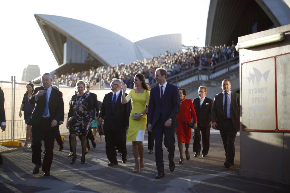 Britain's Prince William and his wife Catherine, Duchess of Cambridge, walk from a reception at the Sydney Opera House April 16, 2014. Prince William and his wife are undertaking a 19-day official visit to New Zealand and Australia with their son, Prince George. REUTERS/Jason Reed (AUSTRALIA - Tags: ROYALS)