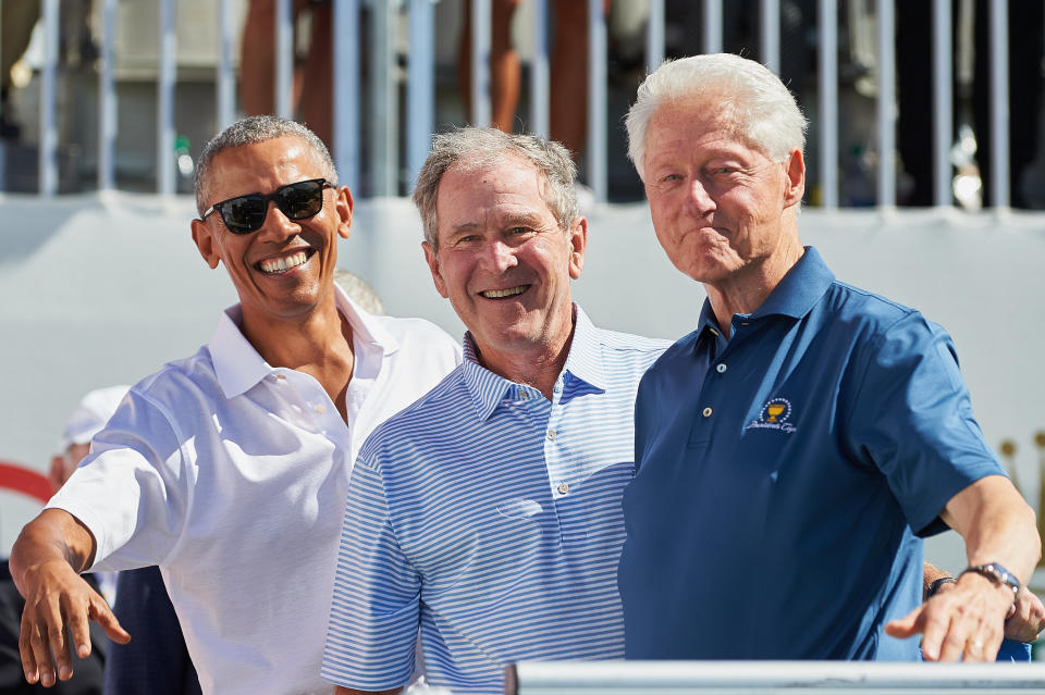 JERSEY CITY, NJ - SEPTEMBER 28:  Presidents Obama, G.W. Bush, and Bill Clinton smile and wave while on the first tee during the first round of the Presidents Cup at Liberty National Golf Club on September 28, 2017 in Jersey City, New Jersey. (Photo by Shelley Lipton/Icon Sportswire via Getty Images)