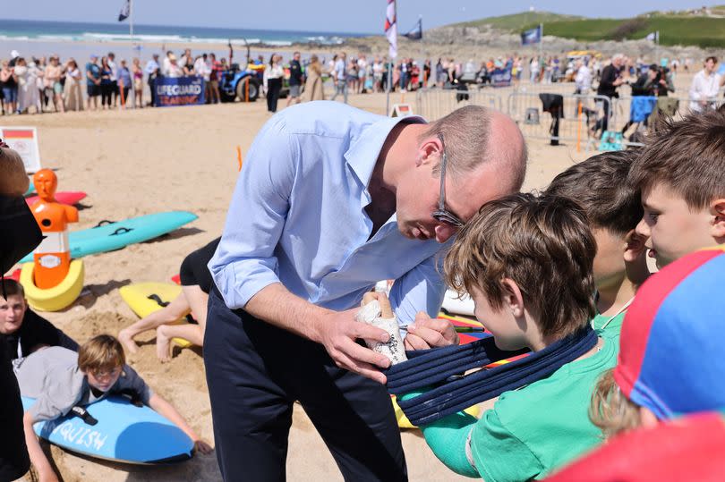 Prince William meets members of a surf life saving club in Newquay -Credit:Greg Martin/CornwallLive