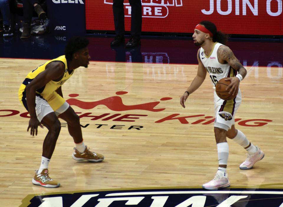 New Orleans Pelicans point guard Jose Alvarado dribbles toward Indiana Pacers guard Aaron Nesmith during the first period of an NBA Basketball game, Monday, Dec. 26, 2022, in New Orleans. (Aimee Cronan/The Gazebo Gazette via AP)
