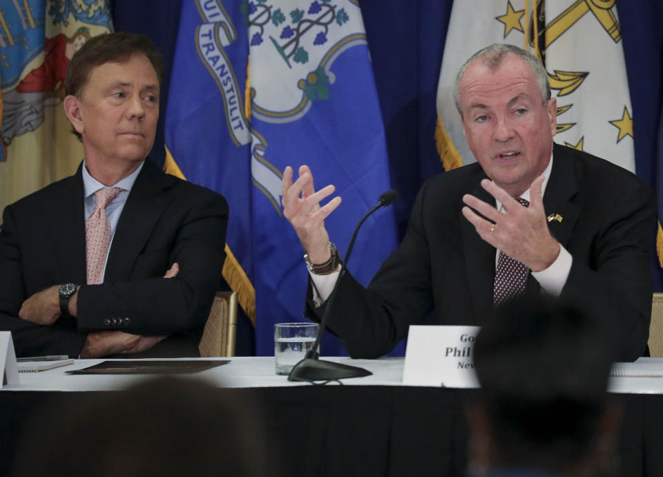 Connecticut Gov. Ned Lamont, left, listens as New Jersey Gov. Phil Murphy, right, addresses a regional summit on public health issues around cannabis and vaping, Thursday Oct. 17, 2019, in New York. (AP Photo/Bebeto Matthews)