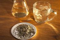 A cup of silver needle tea is pictured on a counter at a Teavana store in New York, October 23, 2013. REUTERS/Carlo Allegri