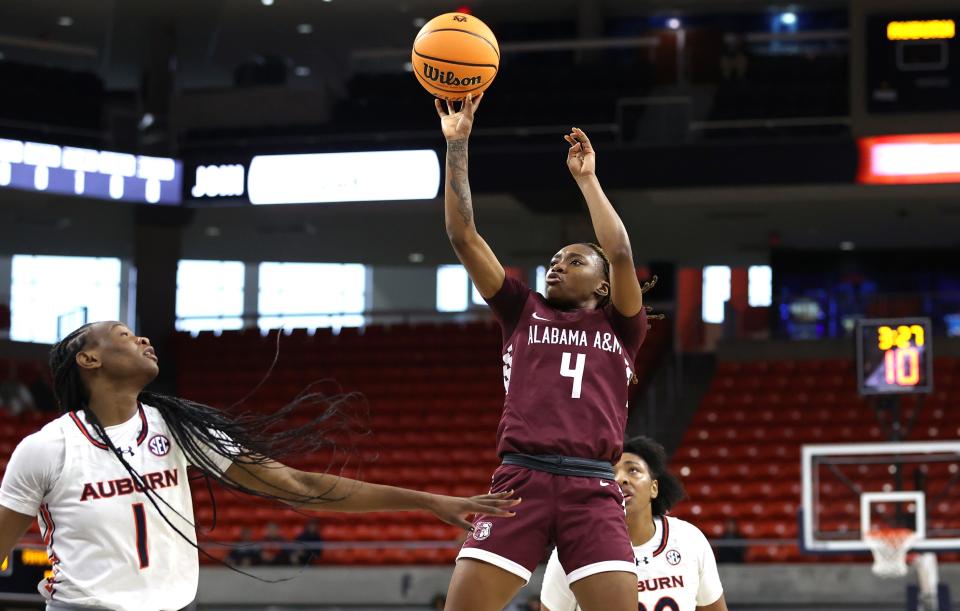 Alabama A&M's Kaylah Turner takes a shot against Auburn during a 2023-24 game.