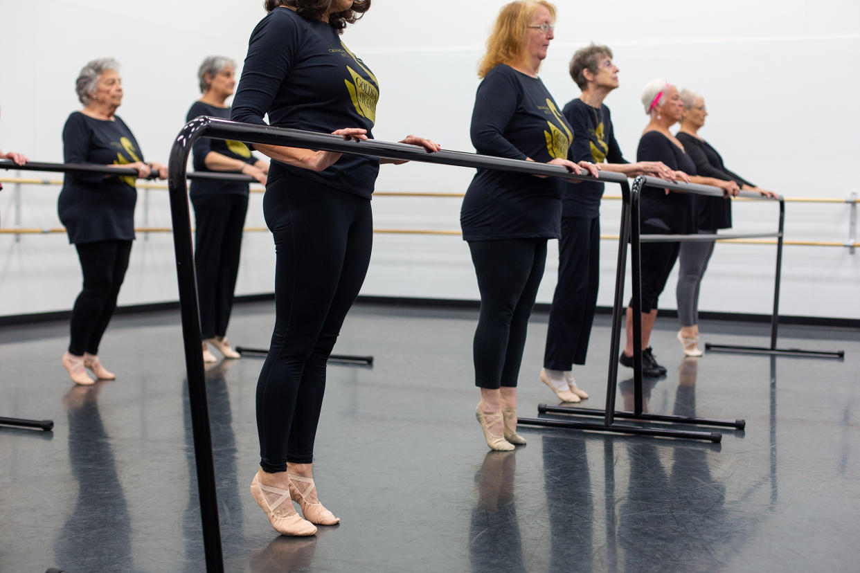 The Golden Swans warm up at the barre. (Courtesy Jana Carson)