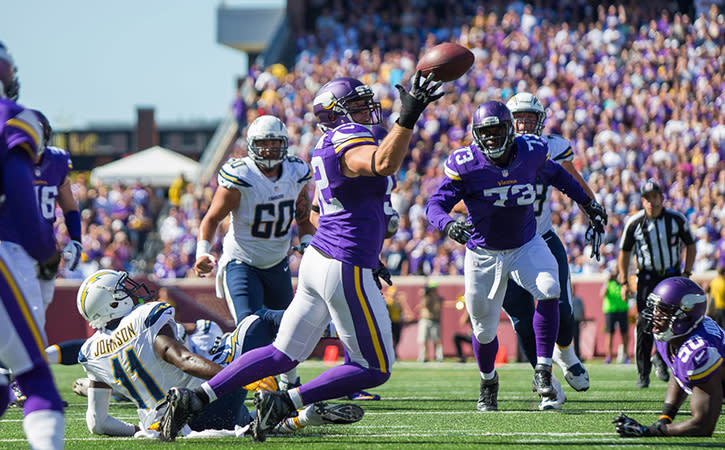 Minnesota Vikings linebacker Chad Greenway intercepts a pass for a touchdown in the fourth quarter against the San Diego Chargers quarterback Philip Rivers at TCF Bank Stadium. The Minnesota Vikings beat the San Diego Chargers 31-14.