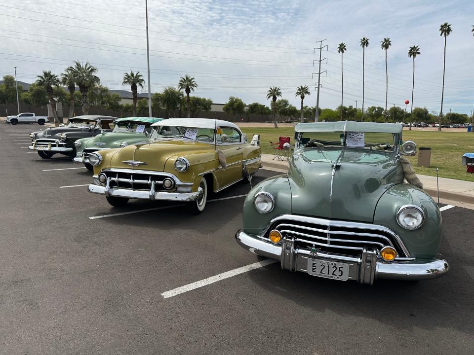 Classic low riders outside the Latino Basketball Showcase in South Phoenix Saturday, March 23, 2024.