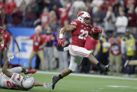 FILE - In this Dec. 7, 2019, file photo, Wisconsin running back Jonathan Taylor (23) runs for a touchdown past Ohio State cornerback Shaun Wade (24) during the first half of the Big Ten championship NCAA college football game, in Indianapolis. Taylor was selected to The Associated Press All-Big Ten Conference team, Wednesday, Dec. 11, 2019. (AP Photo/Michael Conroy, File)