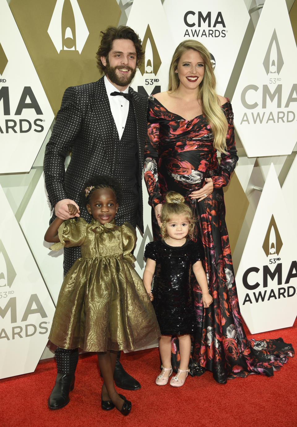 Thomas Rhett, from top left, Lauren Akins, Willa Gray Akins, bottom left, and Ada James Akins arrive at the 53rd annual CMA Awards at Bridgestone Arena on Wednesday, Nov. 13, 2019, in Nashville, Tenn. (Photo by Evan Agostini/Invision/AP)