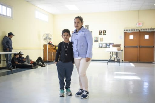 Fanny Mencia, 26, a refugee from Honduras, is pictured with her son Anderson Rodriguez, 7, inside the church hall of the Basilica of San Albino in Mesilla, New Mexico