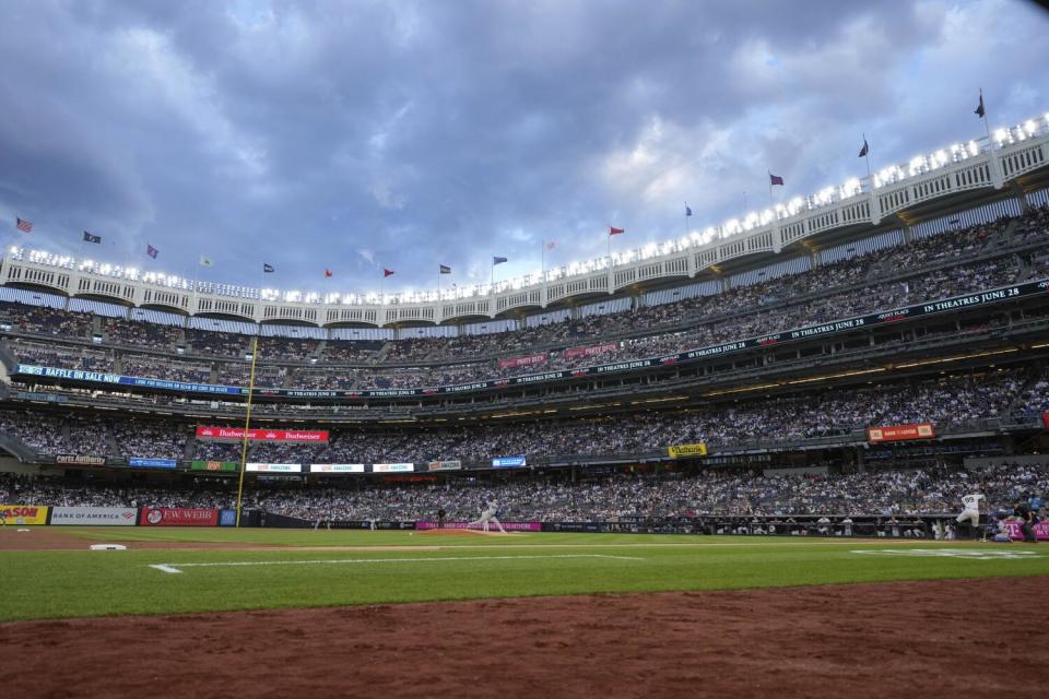 Yoshinobu Yamamoto pitches to New York Yankees star Aaron Judge during the first inning Friday at Yankee Stadium.