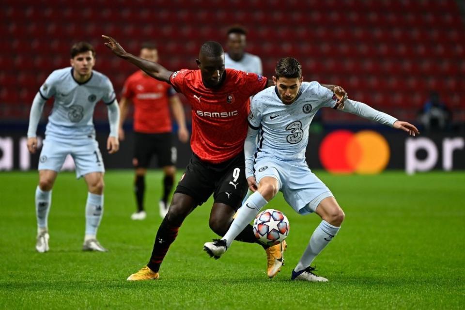 <p>Jorginho fights for the ball with Guirassy</p>AFP