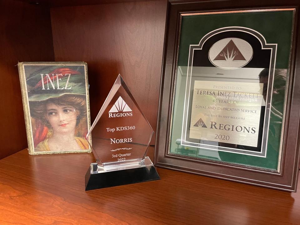 Some awards honoring her service stay with Inez Tackett in her office.