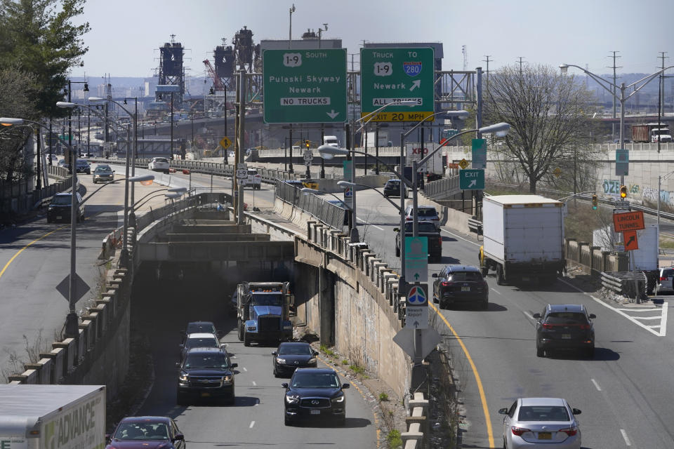 Cars maneuver through tangle of expressways in Jersey City, N.J., Tuesday, April 6, 2021. President Joe Biden is setting about convincing America it needs his $2.3 trillion infrastructure plan, deputizing a five-member "jobs Cabinet" to help in the effort. But the enormity of his task is clear after Senate Minority Leader Mitch McConnell's vowed to oppose the plan "every step of the way." (AP Photo/Seth Wenig)