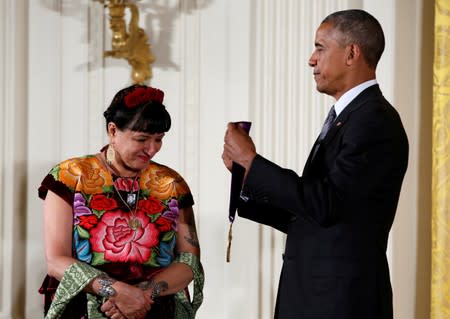 FILE PHOTO: U.S. President Barack Obama awards the 2015 National Medal of Arts to author Cisneros at White House in Washington