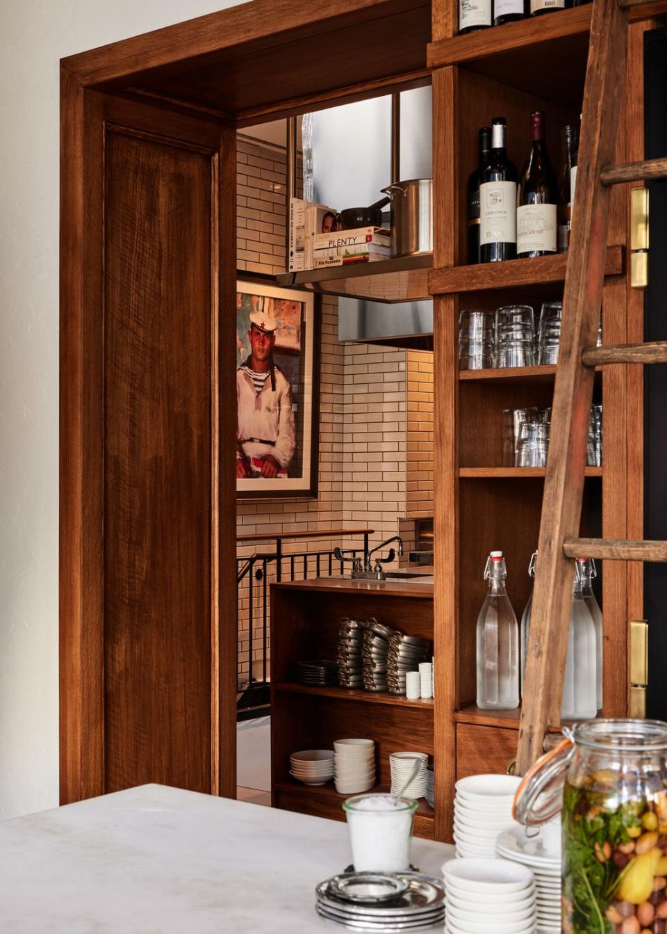 a wooden cabinet with wine bottles