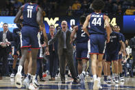 Connecticut coach Dan Hurley reacts during the first half of the team's NCAA college basketball game against West Virginia in Morgantown, W.Va., Wednesday, Dec. 8, 2021. (AP Photo/Kathleen Batten)