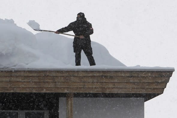 Shoveling snow from roof