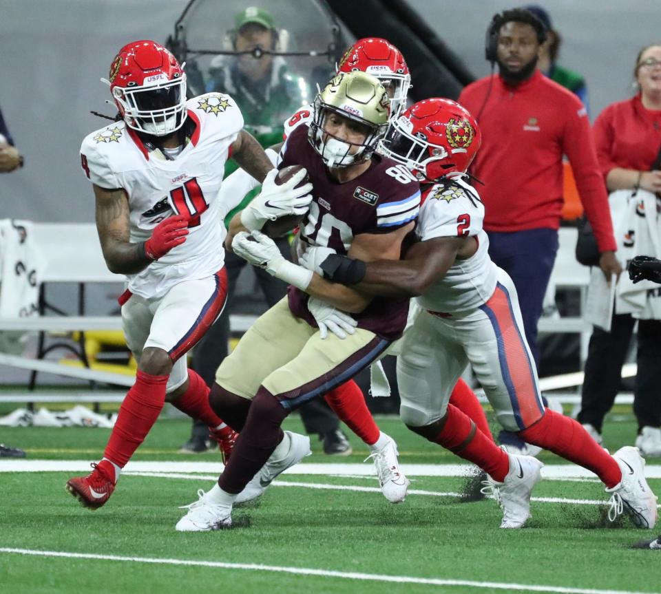 Michigan Panthers tight end Cole Hikutini is tackled by  New Jersey Generals linebacker Chris Orr (2) during the first half Sunday, April 30, 2023 at Ford Field.