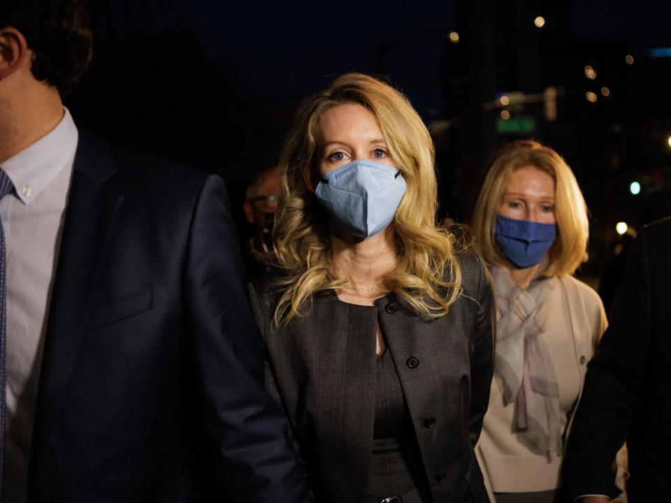 SAN JOSE, CA - January 03: Theranos founder Elizabeth Holmes, center, and her family leave the Robert F. Peckham Federal Building and U.S. Courthouse after the jury found her guilty on four counts in San Jose, Calif., on Monday, Jan. 3, 2022. Holmes was found guilty of four counts of defrauding investors, each carrying a maximum penalty of 20 years in prison.