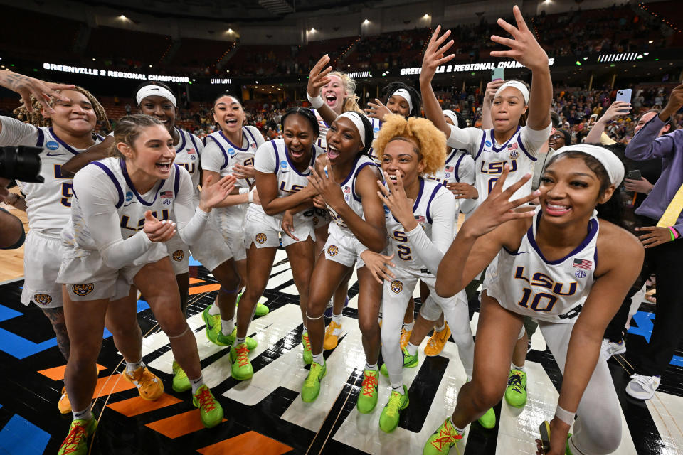 The LSU Tigers celebrate during the 2023 NCAA women's tournament. LSU is atop the preseason AP poll after winning the championship last season. (Photo by Grant Halverson/NCAA Photos via Getty Images)