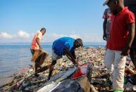 Fisherman return to shore in the impoverished Nan Palan area of Port-de-Paix