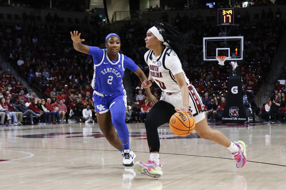 South Carolina guard Te-Hina Paopao, right, drives against Kentucky guard Saniah Tyler (2) during the first half of an NCAA college basketball game in Columbia, S.C., Monday, Jan. 15, 2024. (AP Photo/Nell Redmond)