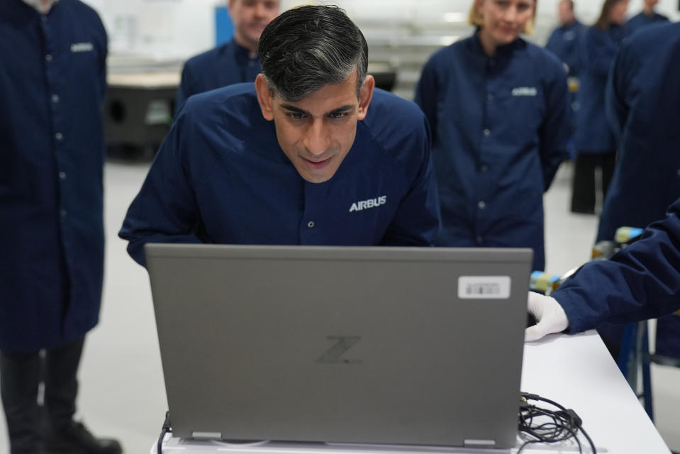 STEVENAGE, ENGLAND - APRIL 26: Prime Minister Rishi Sunak looks at a laptop during a visit to the Airbus factory on April 26, 2024 in Stevenage, England. (Photo by Jacob King - WPA Pool/Getty Images)