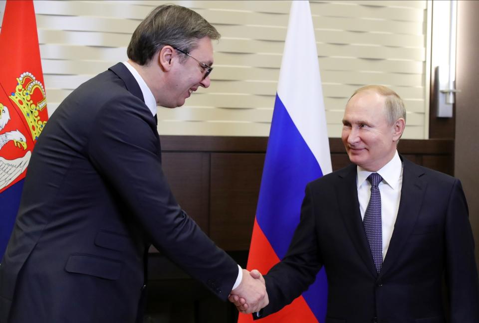 Russian President Vladimir Putin, right, and Serbian President Aleksandar Vucic shake hands during their meeting in the Bocharov Ruchei residence in the Black Sea resort of in Sochi, Russia, Wednesday, Dec. 4, 2019.(Mikhail Klimentyev, Sputnik, Kremlin Pool Photo via AP)