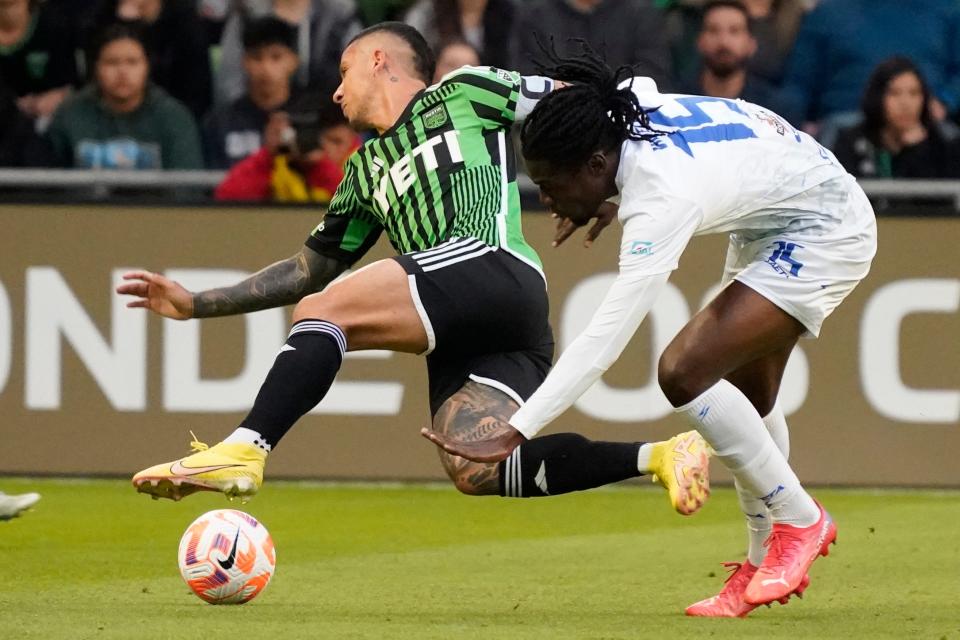 Austin FC forward Sebastian Driussi and Violette AC midfielder Lens Pierre battle for the ball during their March 14 match at Q2 Stadium. Driussi will miss at least two more weeks with a groin injury.