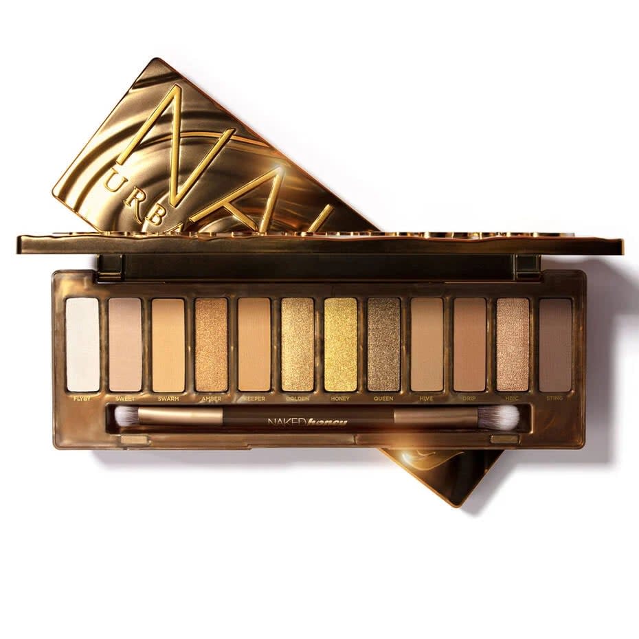 <p>The <span>Urban Decay Naked Honey Eyeshadow Palette</span> ($49) is a pigmented eyeshadow palette packed with various hues of gold. We're talking bronzed golds, yellow golds, champagne golds and more. The 12-pan palette has an array of shimmers and neutral mattes that complement a wide range of golds so you can get creative with your looks. From a golden warm smokey eye to a swipe of a gilded gold for a quick glam moment, you can do it all. </p>