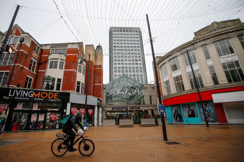 A cyclist rides past Whitgift shopping centre in Croydon, south London, U.K., on Monday, Feb. 22, 2021