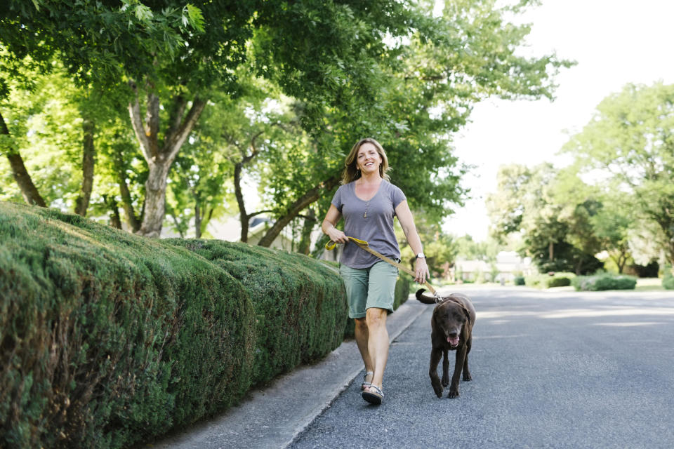 A woman walking her dog