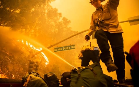 The Woolsey Fire burns north of Pepperdine University in Malibu - Credit: SPLASH