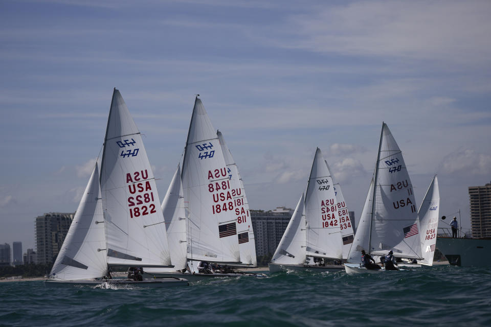 Lara Dallman-Weiss and Stu McNay (1842) compete in the mixed-gender 470 category at U.S. Sailing Olympic Trials, off the coast of Miami Beach, Fla., Friday, Jan. 12, 2024. McNay is returning for his fifth Olympics and teaming up with Dallman-Weiss, who competed in the women's 470 in the Tokyo Games, in the new mixed-gender category. (AP Photo/Rebecca Blackwell)