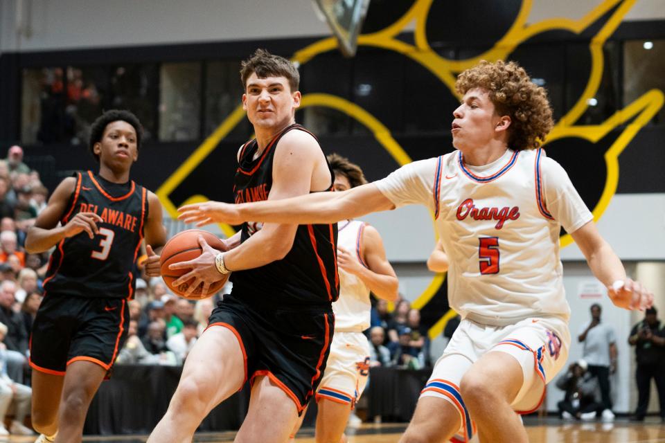 Landon Vanderwarker drives to the basket against Olentangy Orange's Devin Brown during Delaware Hayes' 74-56 regional championship victory Saturday at Ohio Dominican. The win advanced the Pacers to state for the first time.