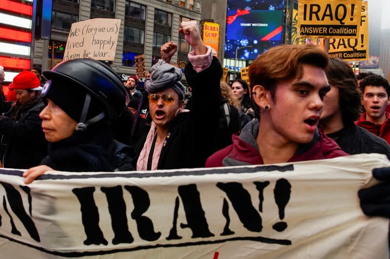 People march as they take part in an anti-war protest amid increased tensions between the United States and Iran at Times Square in New York