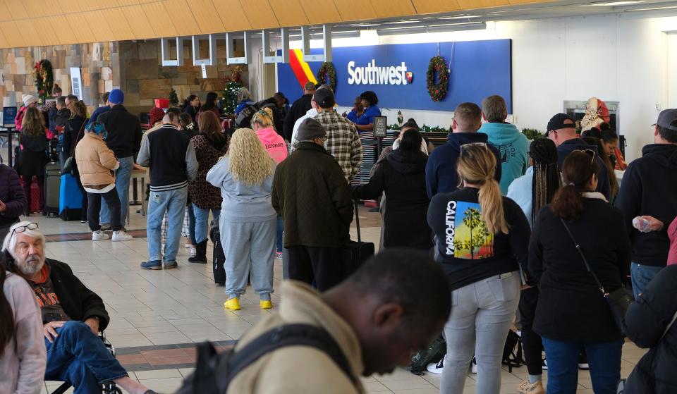 A long line of customers waits Tuesday at the Southwest Airlines ticket counter desk at Will Rogers World Airport in Oklahoma City.