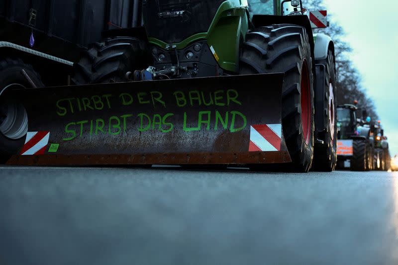 German farmers prepare for a protest against the cut of farm vehicle tax subsidies in Berlin