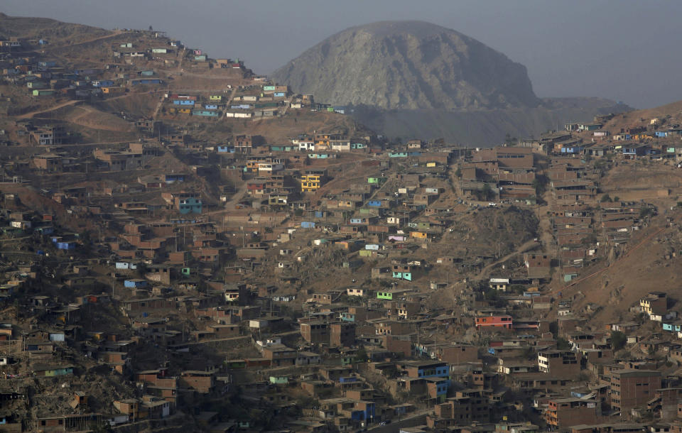 In this Thursday, March 21, 2019 photo, homes fill the hillside in the arid Nueva Esperanza shantytown of Lima, Peru. Residents here pay about $1.50 dollars per 50 liter container which is filled by a water truck service that passes daily. World Water Day will be marked on Friday, March 22, 2019. (AP Photo/Martin Mejia)