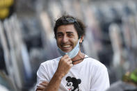 San Diego Padres general manager AJ. Preller laughs after the Padres beat the Seattle Mariners 7-4 in a baseball game Sunday, Sept. 20, 2020, in San Diego. The Padres clinched a spot in the playoffs. (AP Photo/Denis Poroy)