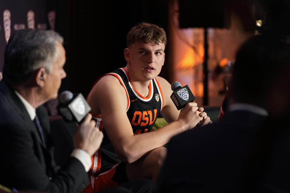 Oregon State's Tyler Bilodeau speaks during a news conference at the Pac-12 Conference NCAA college basketball media day Wednesday, Oct. 11, 2023, in Las Vegas. (AP Photo/John Locher)