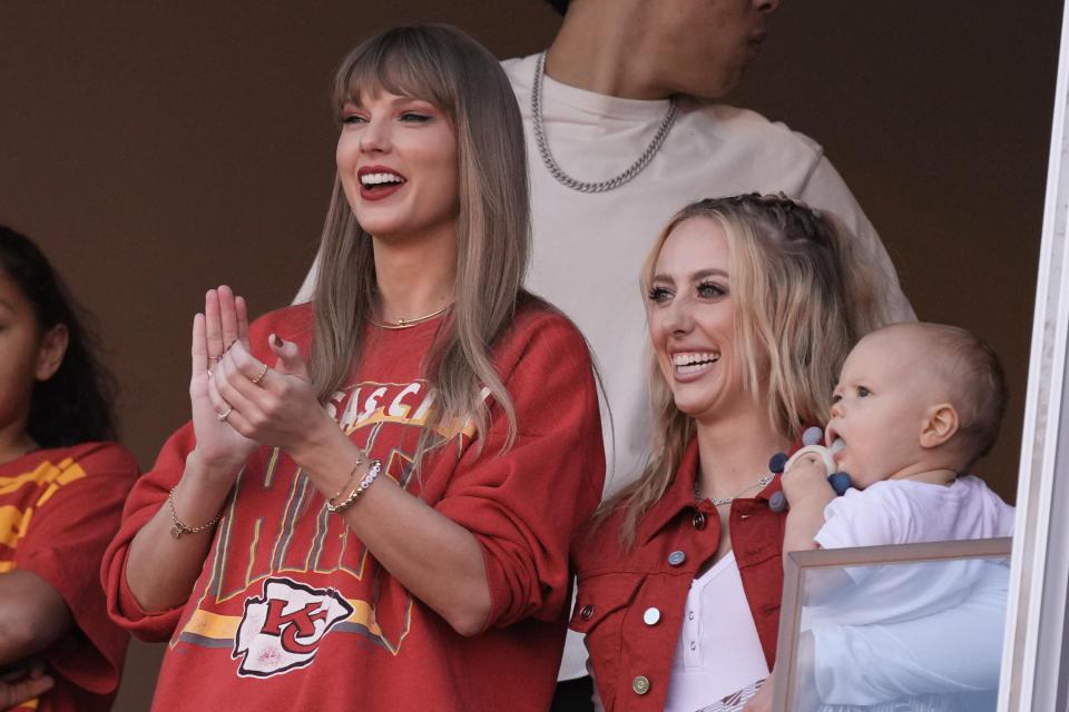 Taylor Swift cheers alongside Brittany Mahomes, right, during the Chiefs' game against the Chargers. (AP Photo/Charlie Riedel)